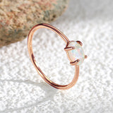 Wholesale Gold Plated Brass Four-Claw Oval White Opal Ring AL585