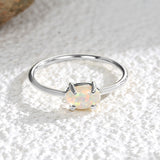 Wholesale Gold Plated Brass Four-Claw Oval White Opal Ring AL585