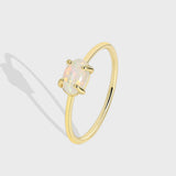 Wholesale Gold Plated Brass Four-Claw Oval White Opal Ring AL585